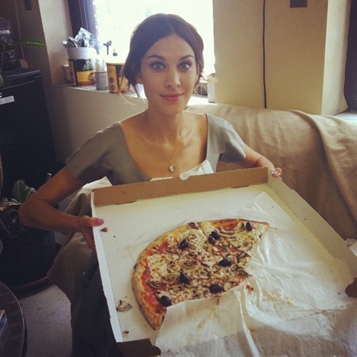 Girl eating pizza