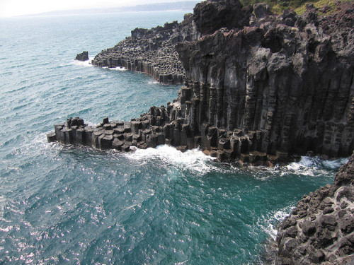 photo by Fai C on Flickr. Jusangjeolli is a rocky cliff with columnar jointing extending 1.3 miles i