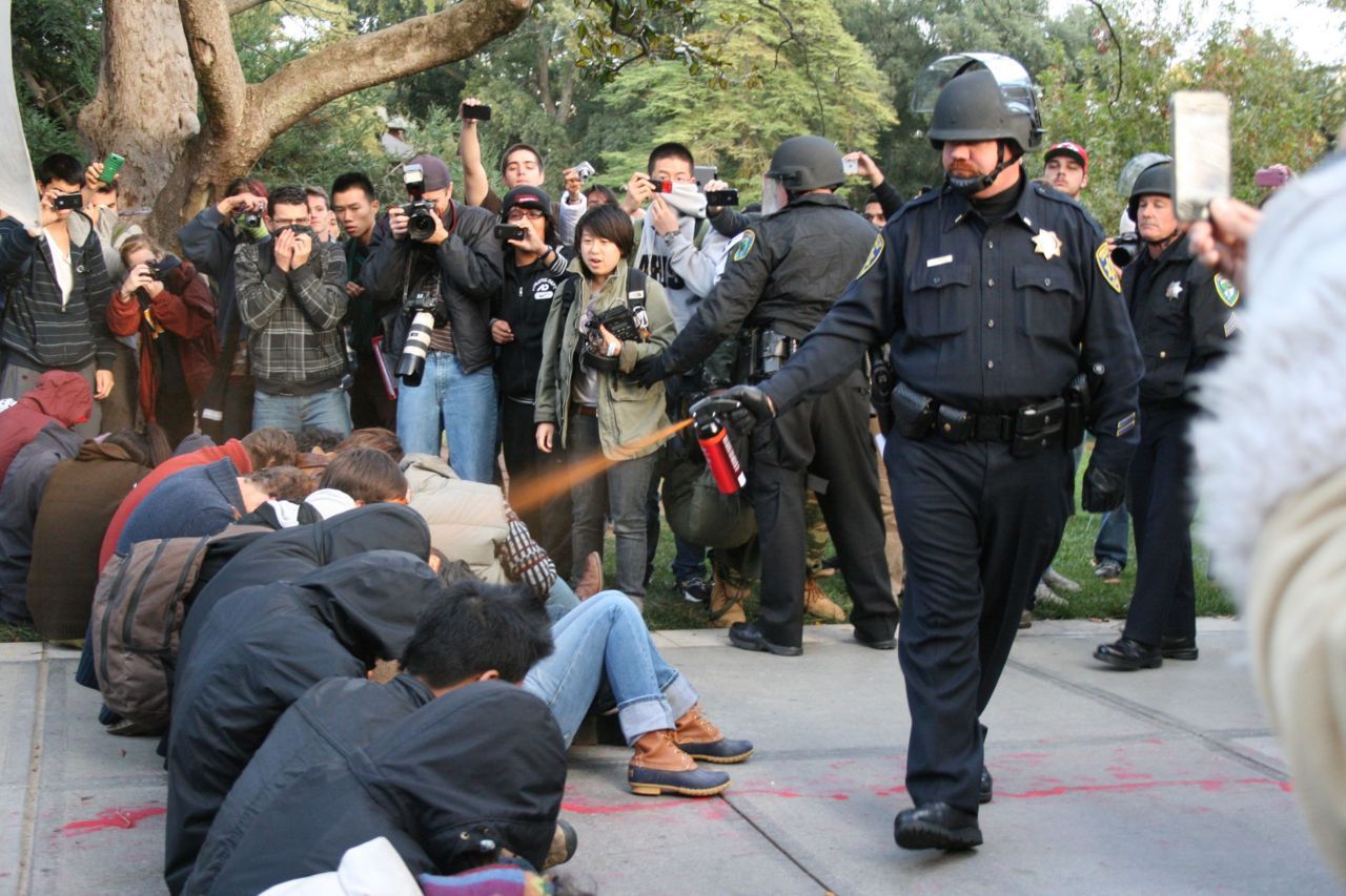kilomonster:  motherjones:  UC Davis police officer pepper sprays sitting students
