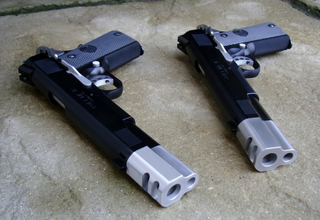 gunsandtitties:  Gorgeous pistols.  Colt 1911s.
