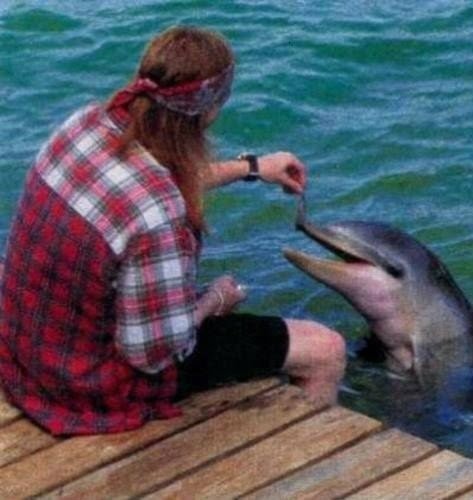ilove-gunsnroses:  Axl DOES love dolpins ;) 