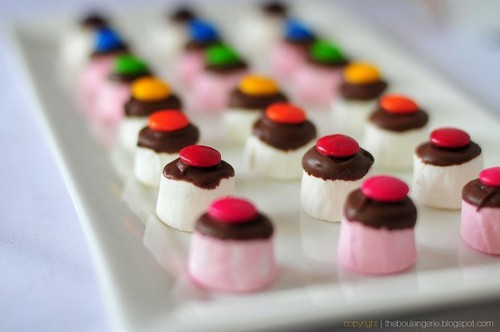  @AdorableBipolar   gastrogirl:  mini marshmallows with chocolate and m&ms. 