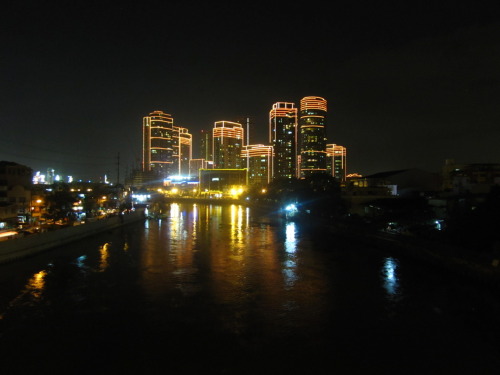 Manila’s Rockwell Centre, on a Sunday midnight, with the Pasig River in the foreground. (Mandaluyong on the left banks; Makati on the right banks.)