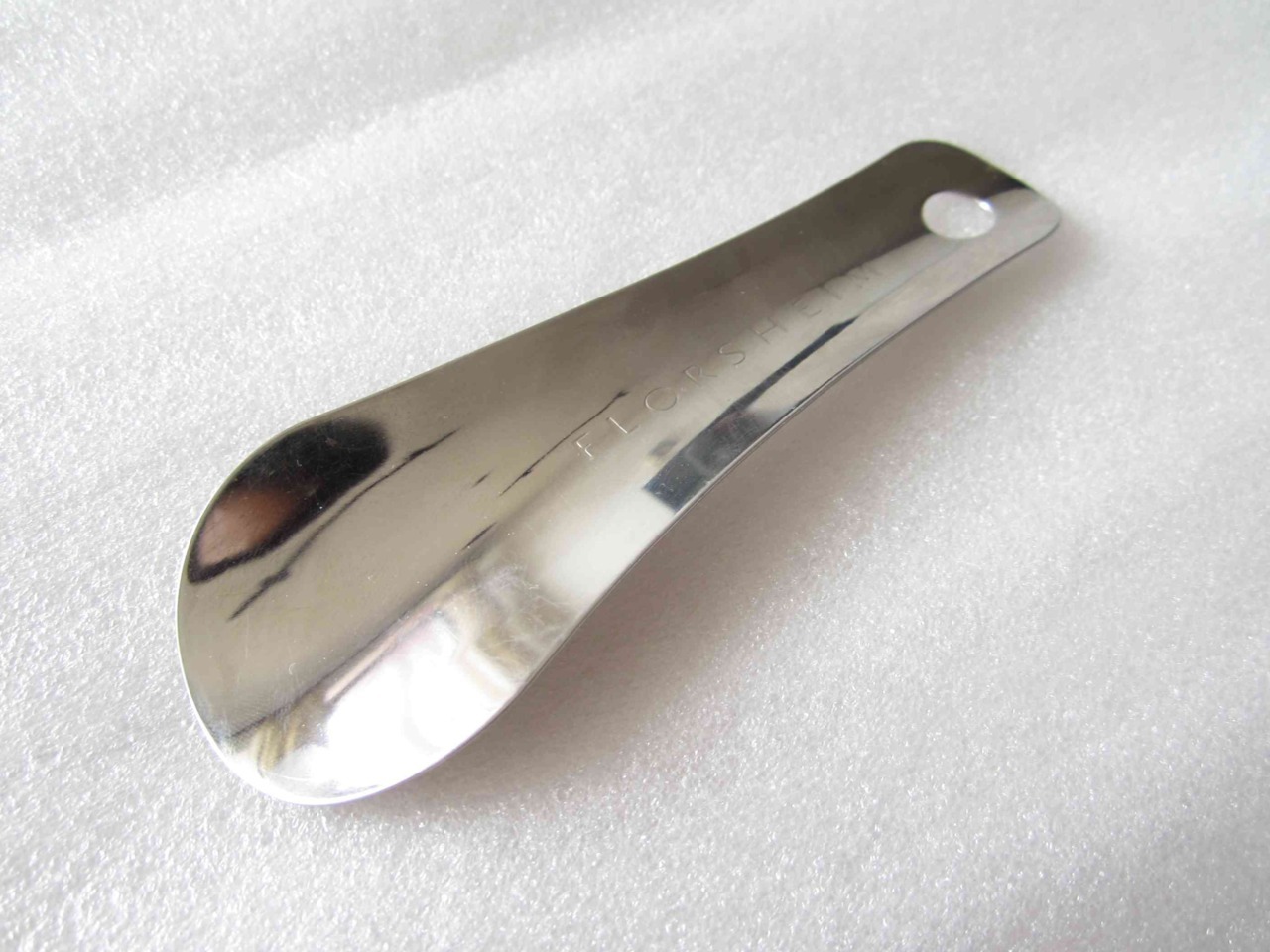 Florsheim Stainless Shoe Horn
Formidable, practical yet elegant shoehorn. Stainless steel made, with deep Florsheim embossed at the centre. Shiny enough to be hanged around your shoe rack, or if circumstances required slipped in your jacket pocket...