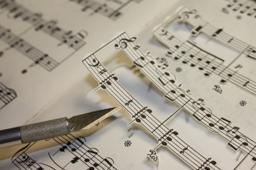 coloredmondays:  Beethoven in Music by Erika Iris Simmons Using an X-acto knife, Erika cut up actual Beethoven sheet music, carefully keeping each note and bar in place before rearranging them into a portrait of the iconic composer, as if Beethoven was