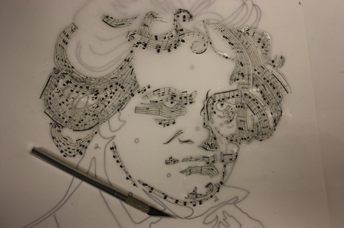 coloredmondays:  Beethoven in Music by Erika Iris Simmons Using an X-acto knife, Erika cut up actual Beethoven sheet music, carefully keeping each note and bar in place before rearranging them into a portrait of the iconic composer, as if Beethoven was