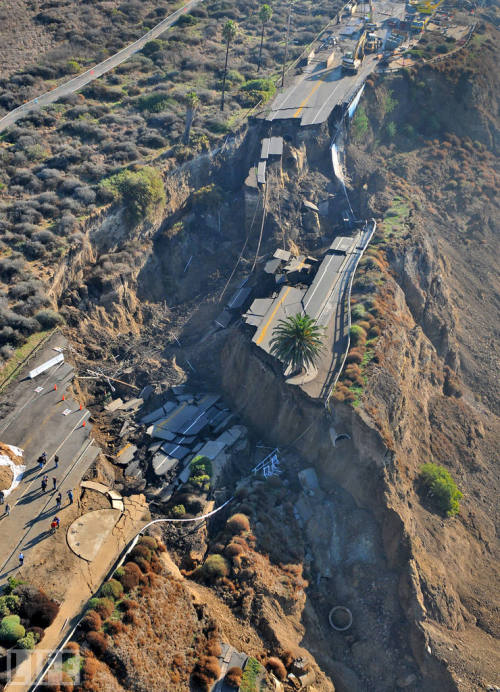 life:  Road most definitely closed… People look at the landslide after a heavy rainstorm collapsed a section of a coastal bluff road in San Pedro, Calif. There were no injuries and no property was damaged. A Los Angeles official says the stretch of