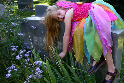 Fairy sleeping on a grave