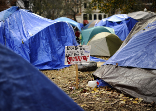 occupyallstreets:A sign is displayed in the midst of Occupy DC protesters tents at the McPherson Squ