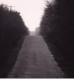 idiocy-isnt-an-emotion-dickface:  cupidsgotagunn:  In Corona, California there once was a road known by most locals as the Never Ending Road. Specifically, the road’s true name was Lester Road. Now, over twenty years later, the landscape of Corona