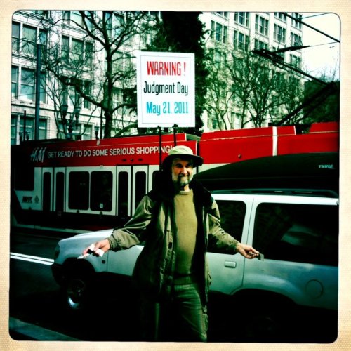 Judgement Day has come and gone, but this guy still hangs out at Pioneer Square.  (Bonus juxtap