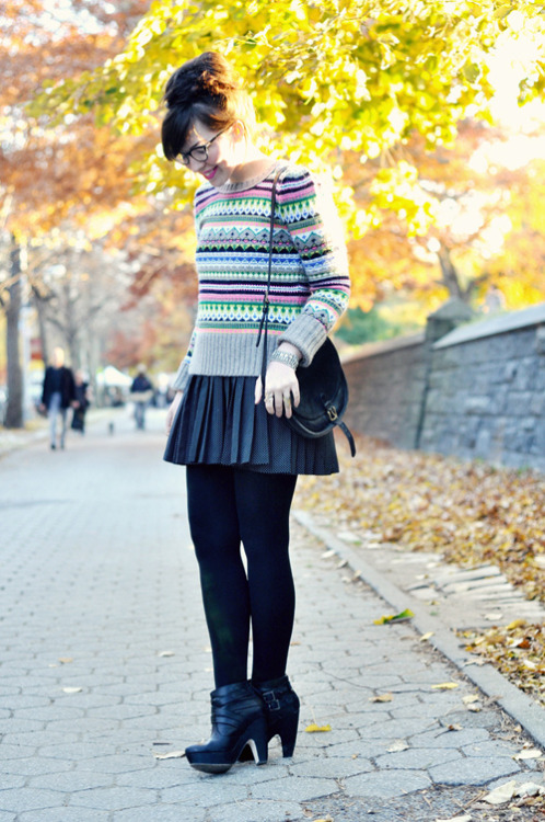Black tights with heels and pleated skirt + cute beige sweater with multicolored nordic style patter