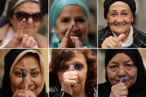 kilele: In a combination image made from six photos, Egyptian women pose with their inked fingers af