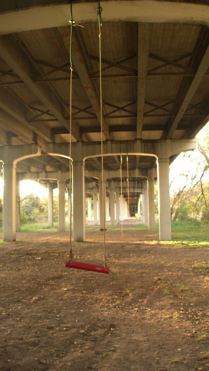 vinniemassimino:  blocks-upon-blocks of swing-sets (under I-35 in East Austin).