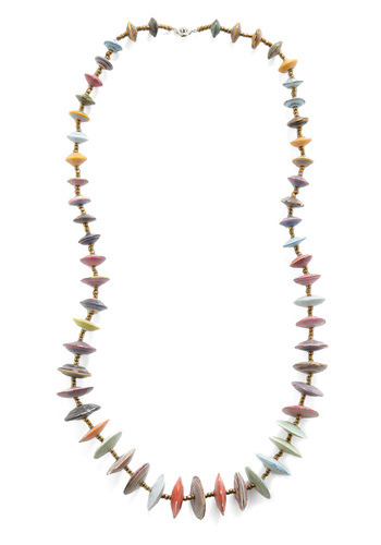 Looking for gifts to support a cause? The Frisbee Yourself Necklace by 31bits is constructed out of recycled paper beads that were handcrafted by women in Uganda.