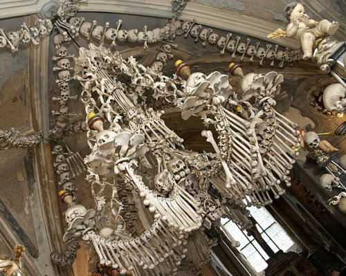 madelezabeth:  skandning:  Outside of Prague, in the Czech Republic, is a small Roman Catholic Church that looks normal on the outside but holds 40,000 to 70,000 skeletons on the inside. Officially called the Sedlec Ossuary, it is often just referred