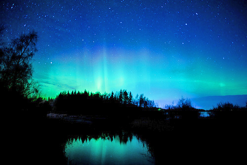connipti0n:  Photo of northern lights, stars, clouds and a creek (by Jonas Wiklund) 
