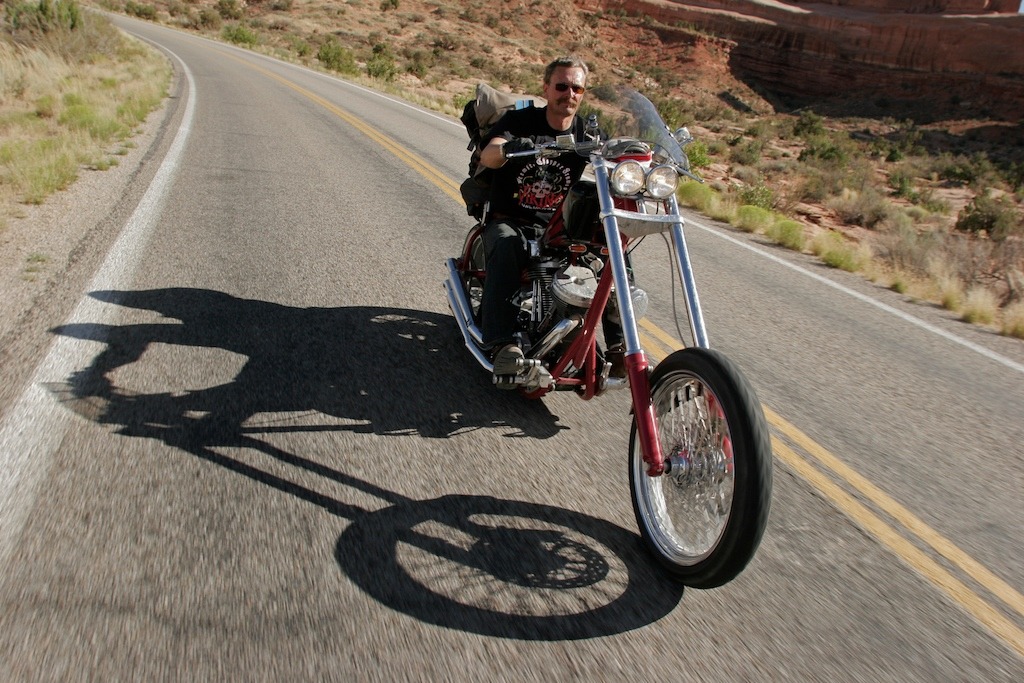 Steinar riding his Indian Powerplus chopper built by MCWorx of Kansas which is owned by his fellow Norwegian Frank Pedersen.
I shot this near to Moab Utah.I was sat backwards on my buddy Lawayne’s Harley trike.