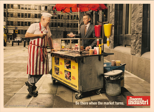 Vintage men eating hot dogs.