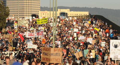 fuckyeahmarxismleninism:Occupy protesters stop a group of big-rigs from entering the Port of Oakland