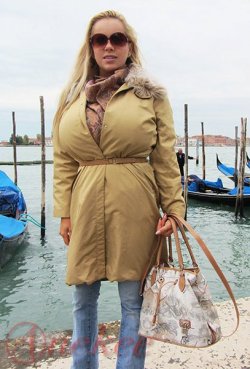 anekee:  Me in Venice. Pic made by my daughter  love the way her enormous tits make the mack bulge outwards wish she was wearing a rubber mackintosh to see how it bulges from ankes huge bust,mmmmmmm,xxxxxxx.