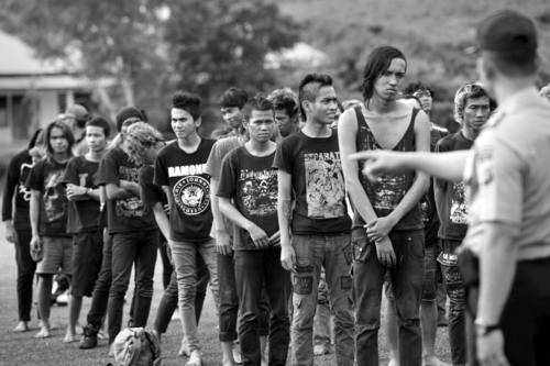 jenobsceneofficial:  The police gathering a group of detained Indonesian punks at a police school in Aceh Besar in Aceh province. Sharia police are “morally rehabilitating” more than 60 young punk rock fans, claiming the youths tarnish the province’s