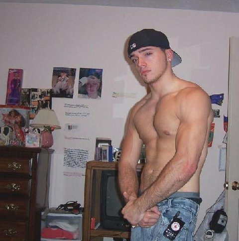 Teen boy flexing muscles