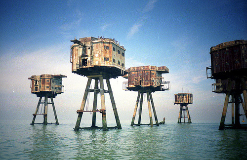 These are sea forts, off the coast of England. They were designed by Guy Maunsell in 1942 to house a