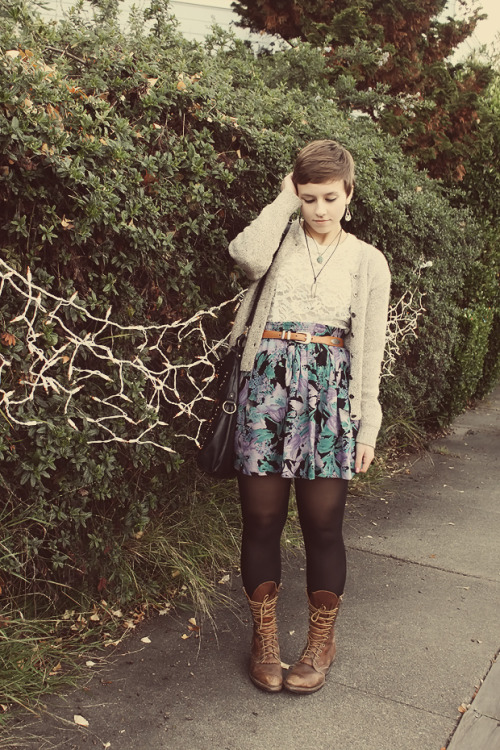 Black tights with brown worn out boots, pastel floral patterned skirt and white lace shirt
