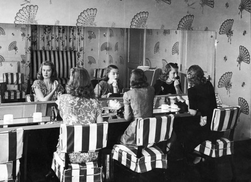 lifeinthe1940s: Women touching up their makeup in the powder room of the Stork Club. Photograph by A