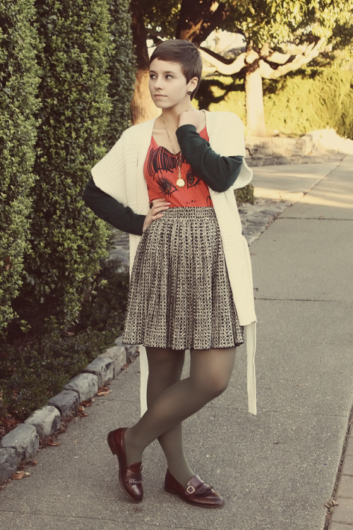 Grey tights with shiny leather flat shoes, grey plaid skirt and bright red t-shirt