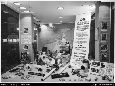 A window display at Harris Scarfe showing a model of an oil drill and other equipment used in drilling for oil in Western Australia, Rundle Street, Adelaide, September, 1954