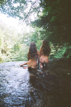 two girls wading 