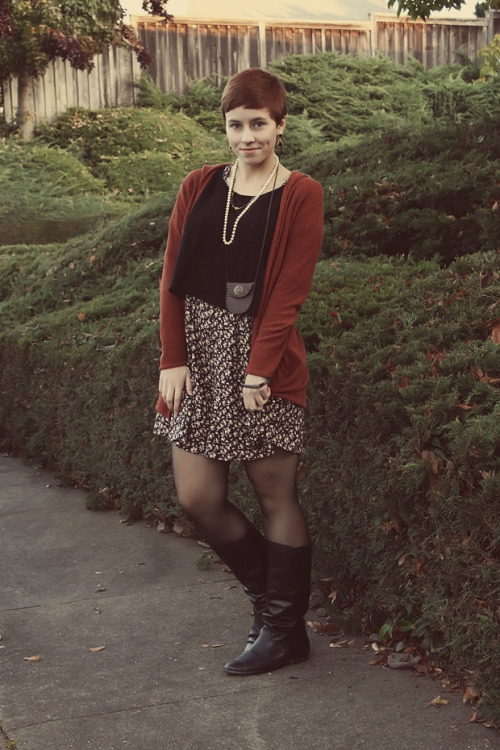 Black tights and boots, with dark red wool coat and floral skirt