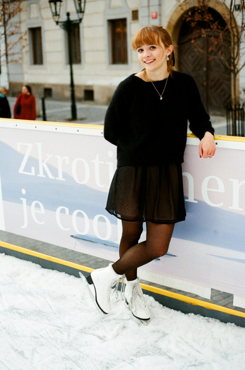 Black tights, see through skirt and white ice skating shoes