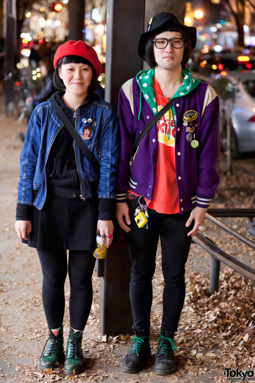 Harajuku guy &amp; girl each wearing a hat, buttons &amp; boots.