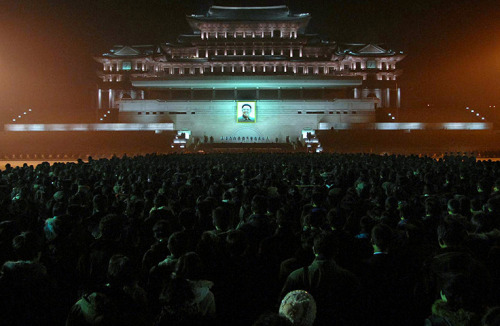 lasociedadelespectaculo:  KCNA / AFP / Getty Images  Pyongyang, North Korea: Thousands of people gather in Kim Il-sung Square to mourn the late North Korean leader Kim Jong-il.  December 21, 2011 