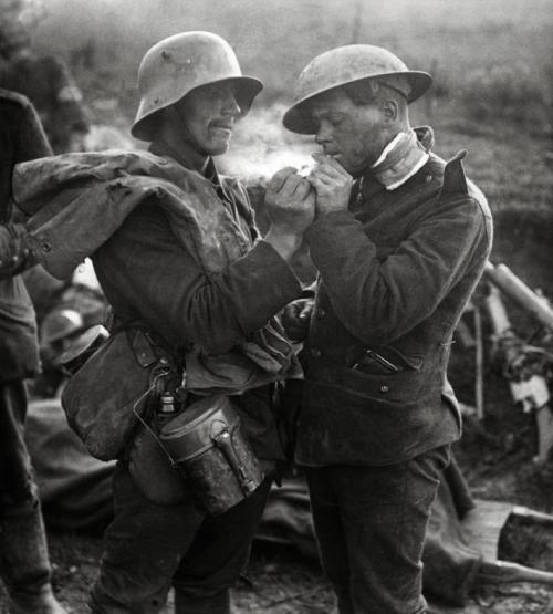  British and German soldiers exchanging cigarettes and other gifts during the Christmas Truce of 1914. December 24-25, 1914 - 97 years ago this Christmas. 