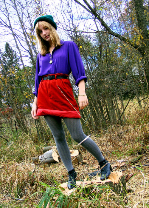 Grey skewed ribbed wool tights with bright red skirt and purple shirt