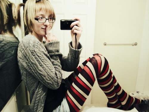 Red black and white striped wool tights with warm grey coat