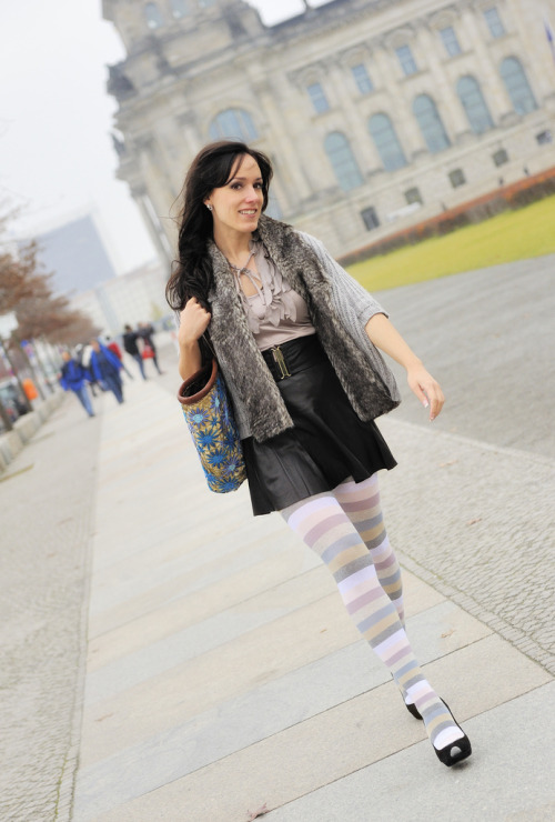 Multicolored pastel tone wool tights with black leather skirt and furry vest