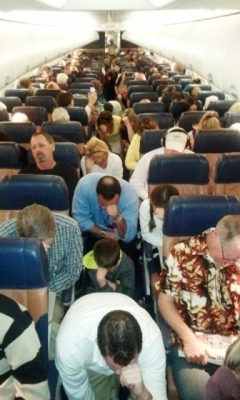tebowing:  Flight attendents on Southwest Airlines Flight 2093 initiating a mass Tebowing at 30,000 ft. 