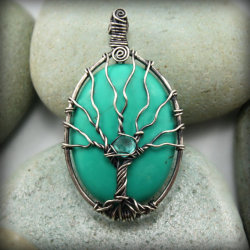 wickedclothes:  Tree of Life Pendant. This mystical tree of life pendant is made of solid .925 sterling silver that is carefully wrapped around a turquoise gemstone. Sold on Etsy. 