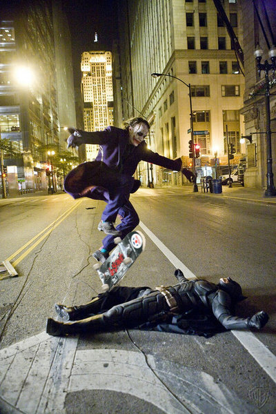 supergreat: Heath Ledger skate boarding over Christian Bale on the set of The Dark Knight.  画