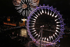 LONDON, ENGLAND - JANUARY 01: Fireworks light up the London skyline and Big Ben just after midnight 