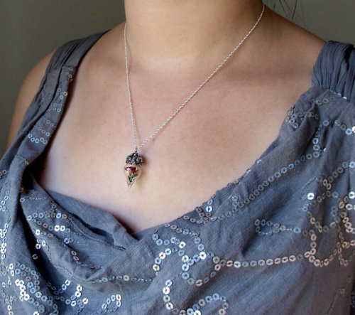 wickedclothes: Red Rose Necklace Terrarium. A realistic miniature rose is showcased inside an elegan