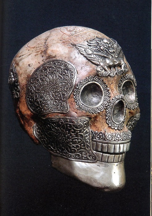 magicanddreamsandgoodmadness:  Tibetan ritual skull with silver work and garuda on the forehead. A garuda is a large mythical bird or bird-like creature that appears in both Hindu and Buddhist mythology. 