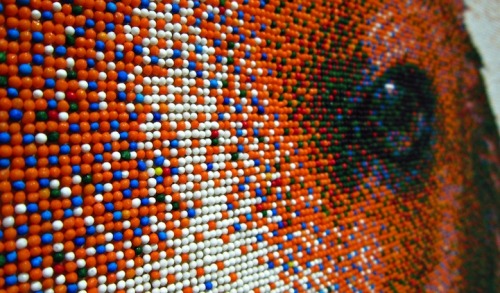  “At a distance of 16 feet, the sprinkles blur, tricking the human eye into believing that it is looking at a large photograph. Only when you closely examine the work do you realize that it has been created entirely with tiny spheres of candy. Taking