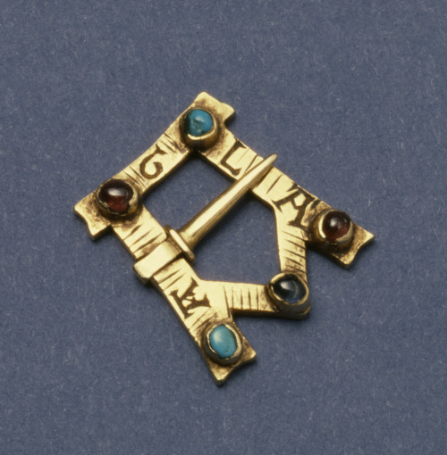 This private, devotional brooch is shaped like an &ldquo;A&rdquo; and inscribed with the abbreviated
