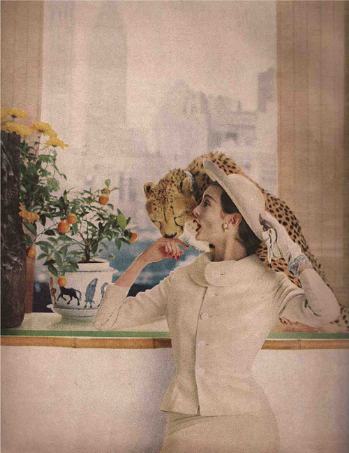 Carmen Dell’Orifice wears a suit by Lilli Ann and straw hat by Hattie Carnegie for Harper’s Bazaar, 